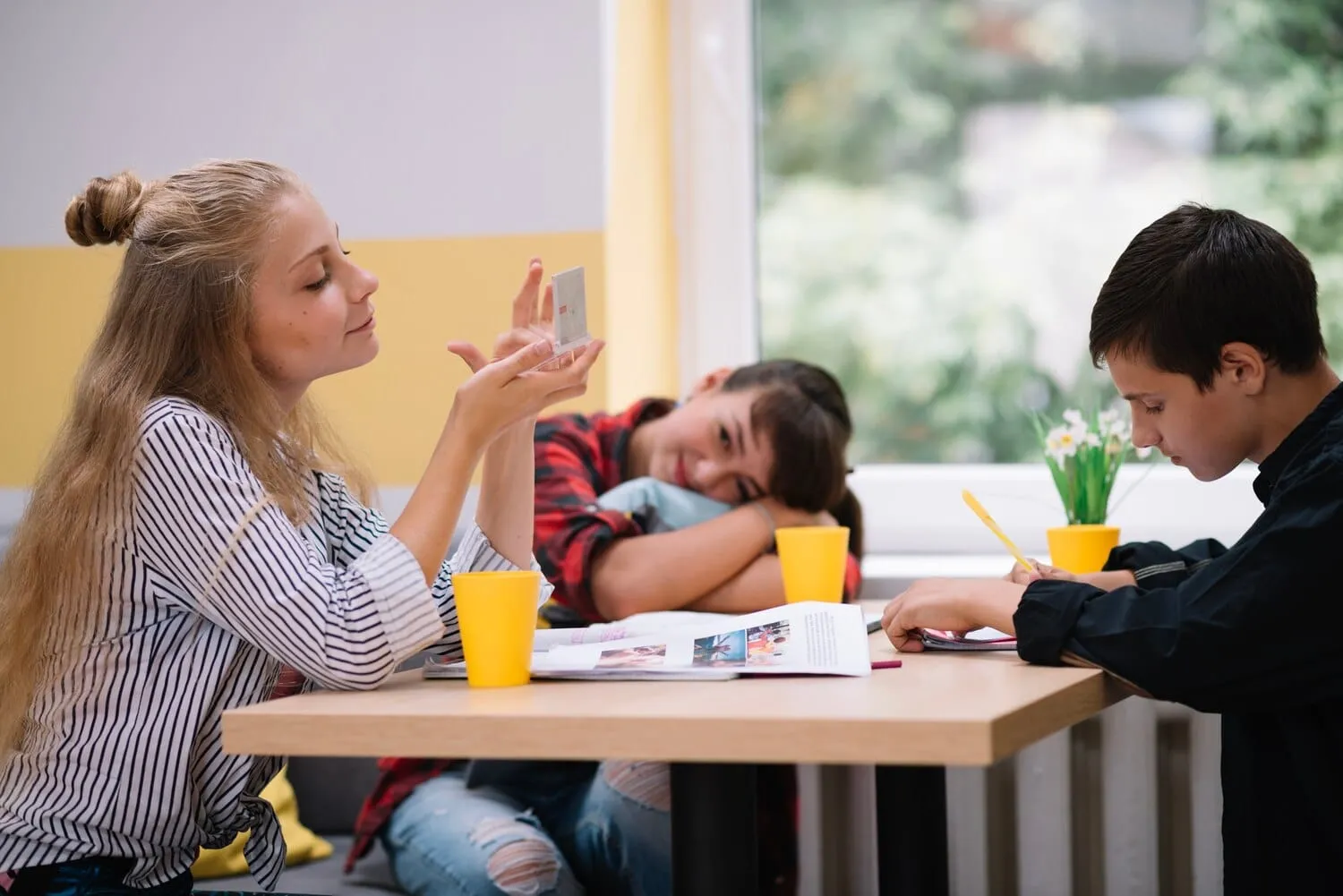 A teacher leading children in a classroom activity